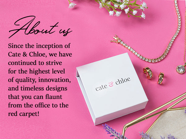Cate & Chloe jewelry box with tennis bracelet, necklace, and earrings on pink background